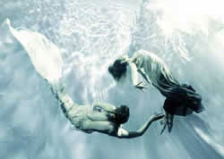 Two Mermaids Circling - Mermaid Model Under Water