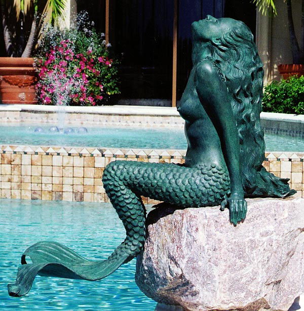 Mermaid statue by pool