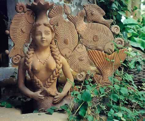 Mermaid statue in garden - Mermaid Cake